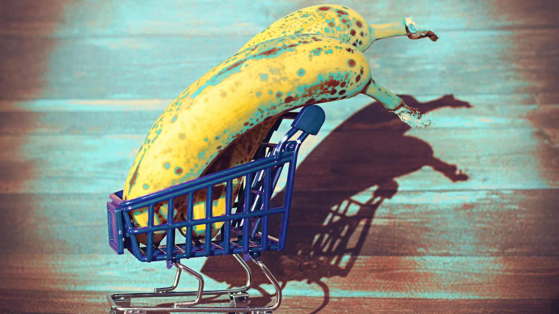Social-Media Banane su un carrello blu in stile pop art